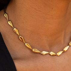 The Story This chic gold chain necklace is the ultimate jewelry staple. Made from rich 18 karat yellow gold, the necklace measures 15.5 inches and sits at the collar bone. Comprised of 25 tear-dropped shaped links, the length is perfect for a shorter, choker look. Made by Birks, an heirloom Canadian brand founded in 1879, the construction is lovely. Each of the links is semi-hollow, so while the necklace has a lovely presence, it's not too heavy. It looks great on its own or worn layered with ot Classic Gold Plated Teardrop Necklace, Gold Plated Drop Necklaces For Formal Occasions, Formal Gold Plated Teardrop Necklaces, Formal Gold Plated Drop Necklaces, Gold Drop Necklace For Formal Occasions, Timeless Gold Drop Necklace For Formal Occasions, Modern Yellow Gold Teardrop Necklace, Timeless Yellow Gold Teardrop Necklace, Classic Gold Pear-shaped Drop Necklace