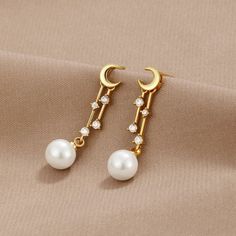 For the Dreamer' Moon & Pearl Earrings - Beautiful Earth Boutique Elegant Moon-shaped Earrings For Gift, Elegant Hypoallergenic Moon-shaped Jewelry, Elegant Hypoallergenic Moon Shaped Jewelry, Elegant Moon Phase Earrings, Elegant Hypoallergenic Crescent Earrings, Elegant White Moon Phase Earrings, Elegant Moon Charm Earrings As Gift, Elegant Earrings With Moon Charm For Gifts, Elegant Hypoallergenic Moon Shaped Earrings