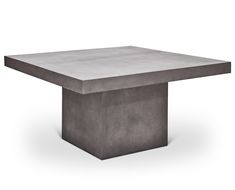 the concrete table is square and has an interesting shape