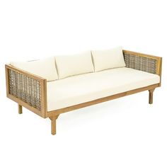 a wooden couch with white cushions on it