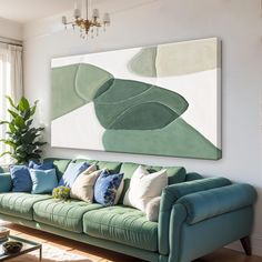 a living room filled with furniture and a painting on the wall