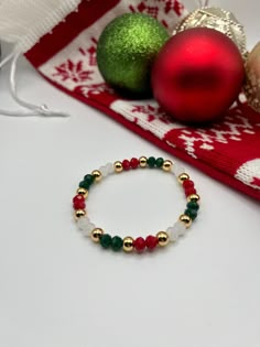 "This Christmas bracelet is perfect to dress up any holiday outfit this season! Make it a stack by combining multiple bracelet designs from the Christmas Collection. ♥️ This bracelet consists of red, gold, and white faceted beads and 14k gold filled beads hand-strung on high performance elastic allowing it to easily stretch on and off your wrist. ♥️ Each bracelet will be made at 6.5-7\" (the average adult female wrist size) unless otherwise specified. Custom size orders are welcome. Please add a Christmas Bracelet Ideas, Pulseras Aesthetic, Velvet Storage, Stocking Stuffers For Her, Lava Bead Bracelet, Multiple Bracelets, Jewelry Holiday, Care Care, Diy Bracelet Designs