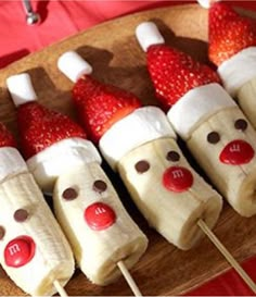 there are some strawberries in the shape of clowns on a plate with toothpicks