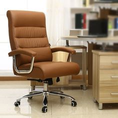 a brown office chair sitting in front of a desk