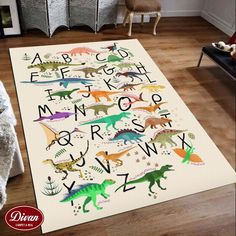 an area rug with dinosaurs and letters on it