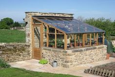 an old stone building with a glass roof