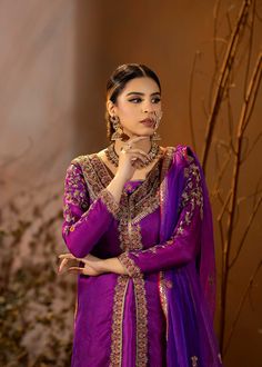 Introducing our stunning Purple Organza Outfit! This elegant dress is adorned with intricate details, featuring beautiful embroidery and embellishments. The rich purple color adds a regal touch, and it comes with a chooridar pajama for a complete look. Perfect for making a statement at special occasions! Purple Churidar With Intricate Embroidery, Embroidered Floor-length Purple Churidar, Embroidered Purple Floor-length Churidar, Purple Raw Silk Salwar Kameez For Festivals, Festival Purple Raw Silk Salwar Kameez, Unstitched Purple Raw Silk Kurta, Designer Raw Silk Purple Salwar Kameez, Designer Wear Purple Raw Silk Salwar Kameez, Designer Purple Raw Silk Salwar Kameez