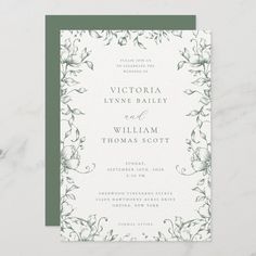 a wedding card with green and white flowers on the front, in an elegant frame