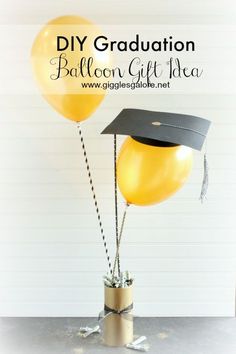 two yellow balloons in a graduation cap and tassel on top of each other with the words diy graduation balloon gift idea