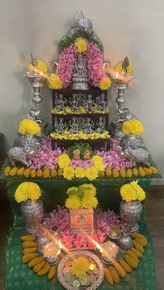 an elaborate display with flowers and candles