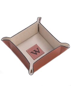 a brown and white leather case with the letter a on it's front side