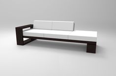 a white couch sitting on top of a wooden frame