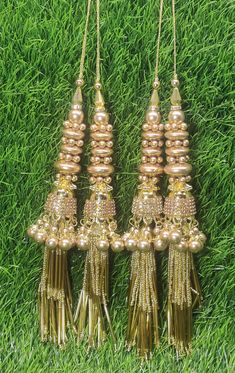 Indian Handmade Golden Latkan for Saree Blouse Lehenga HandBags Hangings Dupatta Decoration Bridal Wedding dress for Women pair of 2 pcs Size - 18.00 cm Length  Item Description You can use this Beautiful pair of tassle for several DIY projects.  *These beautiful Tassel Latkans are used as the accessory for saree blouse on the back, but u can use according to your need and your innovative ideas. * Package contains 2 Latkan / 1 Pair Other Than Saree Blouse, you can use these latkans in various ways Craft Projects Designing Home Decoration Festive celebrations. Evening and party Apparels. Home décor items Apparel & Fashion Scarves n Stoles Headband, hats Table cover, curtains, Pillow covers, Cushion cover Shoe designing Headband, hats Table cover, curtains Designing stylish blouses Ship From Fabric Latkan For Dupatta, Traditional Luxury Chandbalis With Latkans, Luxury Latkans Danglers, Cheap Wedding Chandelier Earrings With Latkans, Latkan Tassels Blouses Accessories, Luxury Chandbalis With Latkans For Wedding, Cheap Jewelry With Latkans For Diwali, Cheap Wedding Chandbalis With Latkans, Gold Semi-stitched Choli With Tilla Details