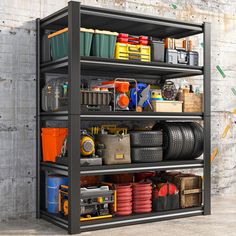 an industrial shelving unit with lots of tools and other items on it's shelves