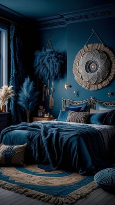 a bedroom decorated in blue and gold with feathers on the headboard, bedding, rugs and pillows