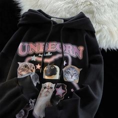 Bread-faced cats on a stylish black hoodie. Kawaii Long Sleeve Hoodie With Cat Design, Cute Cat Print Hooded Hoodie, Cute Long Sleeve Hoodie With Cat Design, Winter Cat Print Hooded Hoodie, Hooded Cat Design Sweatshirt For Streetwear, Black Hoodie With Cat Print, Black Hooded Hoodie With Cat Print, Hooded Cat Print Sweatshirt For Streetwear, Hooded Sweatshirt With Cat Design For Streetwear