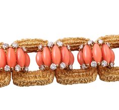 Exquisite 18k gold vintage 1960s bracelet, set with coral and approx. 3.00ctw VS-SI1/H diamonds. DESIGNER: Not Signed MATERIAL: 18k Gold GEMSTONES: Diamond, Coral DIMENSIONS: Bracelet is 6.75" long and 22mm wide. MARKED/TESTED: 18k, E65. WEIGHT: 86.2 grams CONDITION: Previously Owned/Excellent Condition Luxury Coral Jewelry For Formal Occasions, 1960s Bracelet, Sign Materials, David Webb, Coral And Gold, Coral Jewelry, Selling Jewelry, Vintage 1960s, Ring Bracelet