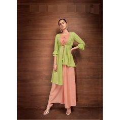 Introducing our new line of stylish contemporary Indian wear! This beautiful set is made from luxurious rayon fabric and features a combination of lime green and peach colors. It's adorned with subtle embroidery, and includes a crop top, palazzo pants, and an overcoat - making it truly unique. Perfect for any special occasion, this outfit will make you feel like a princess! #chirosbyjigyasa #indianclothingusa Green Georgette Anarkali Set For Summer, Summer Green Georgette Anarkali Set, Anarkali Sets In Pista Green For Spring, Green Designer Anarkali Set For Summer, Spring Anarkali Sets In Pista Green, Summer Designer Green Anarkali Set, Pista Green Semi-stitched Sets For Spring, Bollywood Style Pista Green Dress For Spring, Pista Green Bollywood Dress For Spring