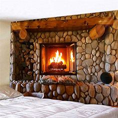 a bedroom with a stone fireplace in the corner and pillows on the bed next to it