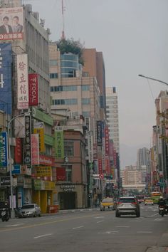 a city street filled with lots of tall buildings