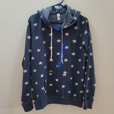 Alternative Nwt Navy Star Hoodie Size L Winter Cotton Top With Star Patch, Casual Cotton Hoodie With Star Print, Winter Cotton Tops With Star Patch, Casual Sweatshirt With Star Patch For Fall, Winter Cotton Sweatshirt With Star Print, Casual Fall Sweatshirt With Star Patch, Casual Long Sleeve Star Print Hoodie, Casual Long Sleeve Sweatshirt With Star Print, Casual Hooded Hoodie With Star Print