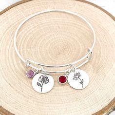 Birth Flower Bracelet • Birthstone Bracelet • Birth Month Flower Bracelet • Personalized Birth Flower Bracelet • Gift For Mom Have this bangle bracelet personalized with the birth flower(s) and birthstone(s) of your choice! Personalized jewelry makes the perfect gift for so many occasions. Each Adjustable Crystal Bracelet With Flower Charm, Adjustable Flower Charm Bracelet, Adjustable Flower Crystal Bracelet Gift, Silver Flower Crystal Bracelet For Gift, Silver Flower Crystal Bracelet As Gift, Silver Flower Crystal Bracelet Gift, Birth Flower Bracelet, Custom Engraved Bracelet, Handwriting Bracelet