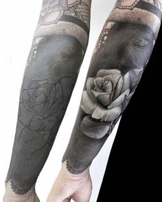 the arm is covered in tattoos and has a rose on it