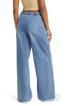 Make a statement in these pleated, vintage-inspired jeans fashioned with trouser-style pockets and superwide legs that sway with every step. 32" inseam; 30" leg opening; 11 1/2" front rise; 15 1/2" back rise Zip fly with button closure Side slant pockets 63% cotton, 27% polyester, 8% rayon, 2% spandex Machine wash, tumble dry Imported Denim Wide-leg Bottoms With Side Pockets, Wide-leg Cotton Jeans With Welt Pockets, Super Wide Leg Jeans, Pull-on Denim Bottoms With Tapered Leg, Pre-washed Cotton Wide Leg Jeans, Wide-leg Rigid Denim Bottoms With Belt Loops, Trouser Style, Jeans Style, Wide Leg Jeans