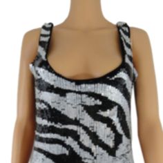 Title: Zara Collection Black & White Sequin Top Size L (Sku 000051) Description: Sexy Sleeveless Sequined Top. Sequin Design Is Zebra Print. Front Is Sequins,Back Is Solid Black No Sequins. You Will Shine On The Dance Floor. Size: L Color: Black And White Fabric: 96% Viscosa, 4% Elastano Care: Dry Clean Condition: Good Pre-Owned. Gently Loved. No Markings Or Noted Damages. White Fitted Tank Top For Party, Glamorous Black Summer Tank Top, White Fitted Tank Top For Evening, Trendy White Tank Top For Party, Fitted White Tank Top For Evening Wear, Fitted White Sequined Tank Top, White Sequin Top, Sequined Top, Zara Collection