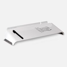 a pen and paper holder with writing on it