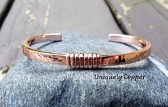 This simple, yet gorgeous copper cuff bracelet is one of my favorites! It is hand forged, hammered, wire wrapped and polished to a brilliant shine. Perfect as a 7th anniversary gift or Mother's Day gift!  SIZING~ To ensure correct sizing, if you don't have a sewing tape measure, simply take a piece of paper and slip it around your wrist to where it is most comfortable to you. Then measure the paper with a ruler, deduct 1 1/4 inches from the measurement for the opening, and you will have your cor Cooper Jewelry, Mens Copper Bracelet, Handmade Copper Bracelet, Stacking Bangles, Sewing Tape Measure, Copper Bracelets, Copper Jewellery, Metal Cuff Bracelet, Metalsmithing Jewelry