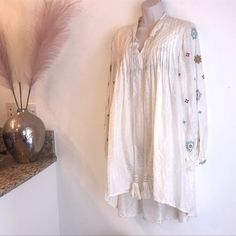 Cream Colored Silk Dress Is Sheer With Embroidery On Sleeves Two Front Tassels Excellent Used Condition No Pockets Or Zipper Made In India Sleeves Have One Button Size: Large Measurements Are Approximate Bust: 24 Inches (Front) Shoulder To Hem: 32.5 Inches (Back) Shoulder To Hem: 40 Inches Sleeve Length: 24 Inches {#46 S/S Dresses} Questions? Leave A Comment Below! Offers Welcome! Daywear Tunic Dress With Floral Embroidery, Spring Embroidered V-neck Tunic, Embroidered V-neck Tunic For Spring, Beige Long Sleeve Embroidered Dress For Spring, V-neck Embroidered Tunic For Spring, Floral Embroidery Tunic Dress For Daywear, Floral Embroidered Tunic Dress For Daywear, Elegant Summer Tunic Embroidered Dress, Elegant Summer Tunic With Floral Embroidery