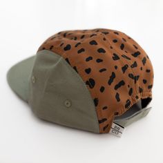 This hat is made by Rad River Co. in collaboration with Summer in May. Features an adjustable velcro back and fabric eyelets on the side panels. Size 1: Designed to fit kids aged 9 to 36 months.Size 2: Designed to fit kids aged 3 to 5 years.Size 3: Designed to fit kids aged 6 to 10 years. *Models 1 and 2 are wearing size 2*Models 3 and 4 are wearing size 3 100% Polyester Playful Brown Adjustable Hat, Adjustable Green Hat For Playtime, Adjustable Baseball Cap For Summer Playtime, Casual Adjustable Hats For Play, Adjustable Casual Play Hat, Playful Adjustable Snapback Hat With Curved Brim, Playful Outdoor Snapback Hat, Playful Snapback Hat For Outdoors, Playful Snapback Hat For Outdoor