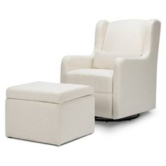 a white chair and footstool sitting next to each other