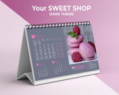 a desktop calendar with pink macaroni and raspberries on it for your sweet shop