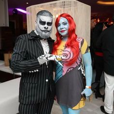 a man and woman dressed up as jack skellingy and corpse from the movie