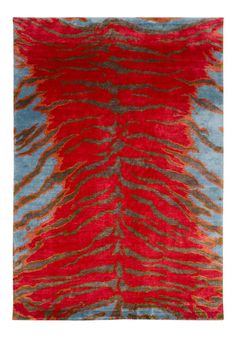 a red and blue rug with an abstract design