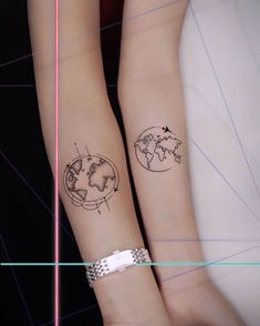 two people with matching tattoos on their arms