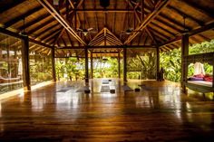 the inside of a building with wooden floors