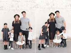 a family poses for a photo in front of a white wall wearing black and gray outfits