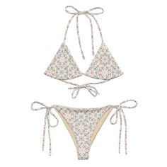 This String Bikini set design was inspired by the sandy shores of Panama. Made from soft recycled polyester with double-layering and UPF 50+. Style the straps how you like, and get ready to swim! Brand: BOHIQ Bikini top with removable padding Pattern: Tribal Pattern UPF50+ protection Sizes 2XS to 6XL Fabric: 81% recycled polyester, 19% Lycra spandex OEKO-TEX 100 standard certified Global Recycled Standard (GRS) certified Multiple ways to tie and style the bikini set Care: Thoroughly rinse it off Adjustable Straps Beachwear Swimwear, Adjustable Swimwear For Sunbathing Beachwear, Adjustable Beachy Swimwear For Beach Season, Adjustable Tankini For Sunbathing Beachwear, Adjustable Tankini For Sunbathing, Adjustable Fit Tankini For Sunbathing, White Swimwear With Adjustable Straps For The Beach, Beachy Adjustable Swimwear Bra Friendly, Beachy Adjustable Swimwear, Bra-friendly