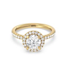 a yellow gold engagement ring with round diamonds