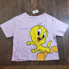 Nwt | Looney Tunes/Love Tribe Hybrid Pink Novelty Tweety Crop Tee Trendy Yellow Tops With Cartoon Print, Trendy Yellow Tops With Character Print, Playful Yellow Top With Cartoon Print, Yellow Short Sleeve Top With Character Print, Cute Yellow Top With Character Print, Cute Yellow Tops With Character Print, Fun Yellow Tops With Character Print, Cute Yellow Crew Neck Top, Cute Yellow Top With Graphic Print