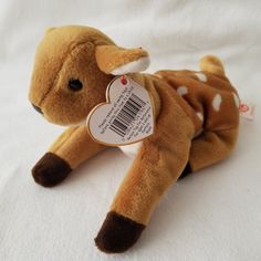 a stuffed animal with a tag on it's ear