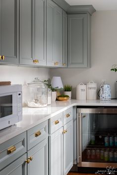 the kitchen is clean and ready to be used as a beverage dispenser