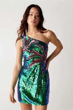 Make it shimmer. Feel confident in this dress, made from a high quality material with a unique palm tree sequin design, a one shoulder style and a flattering mini fit. Pair with chunky boots and accessories for a dance-floor ready look that will take you from festival season to concerts and beyond.  Palm Tree Sequin One Shoulder Dress High Quality Material Fun Palm Tree Sequin Design One Shoulder Style Flattering Mini Length Model wears a size S (US size 6/UK size 10). Sequin One Shoulder Dress, Sequin Design, Chunky Boots, Dance Floor, Feel Confident, Palm Tree, Festival Season, Palm Trees, One Shoulder Dress