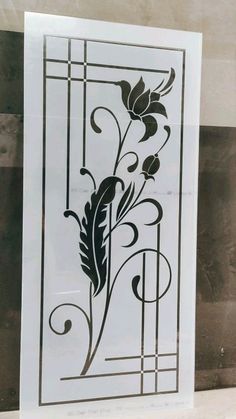 an art nouveau stencil with flowers and swirls in black on white paper