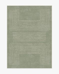 a green rug with white lines on the bottom and one line in the middle, against a gray background