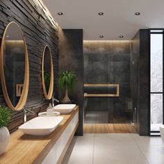 a modern bathroom with two sinks and mirrors