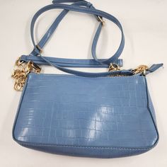 Urban Expressions Aster Crossbody Bag Women'S One Size Blue Zipper Closure Urban Expressions Aster Crossbody Bag Women's One Size Blue Zipper Closure Retail $70.00 This Beautiful Crossbody Bag From Urban Expressions Is Perfect For Any Occasion. The Bag Features A Stunning Blue Exterior With A Crocodile Skin Pattern And Gold Hardware Accents. The Zipper Closure Ensures That Your Belongings Stay Safe And Secure, While The Crossbody Strap Allows For Convenient Hands-Free Carrying. Inside The B Trendy Blue Shoulder Bag With Zipper Pouch, Casual Blue Shoulder Bag With Zipper Pouch, Trendy Blue Shoulder Bag With Zipper Closure, Blue Shoulder Bag With Zipper Closure, Ideal As Gift, Functional Blue Crossbody Shoulder Bag, Blue Crossbody Shoulder Bag With Zipper Pouch, Light Blue Shoulder Bag With Zipper Closure, Blue Crossbody Bag With Zipper Closure, Blue Crossbody Bag